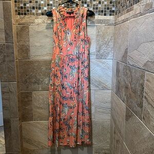 Coral sleeveless long dress with tie in front.